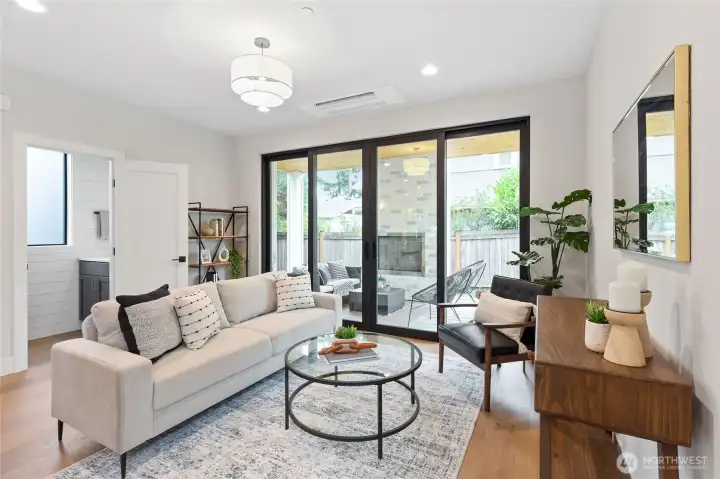 Cozy indoor-outdoor flow with a fireplace, perfect for relaxing or entertaining year-round.