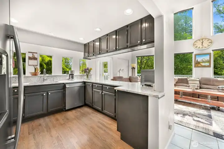 Kitchen opens to dining and living rooms