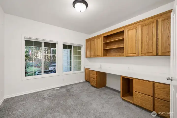 Home office overlooking the front yard. Plenty of work room and storage space.