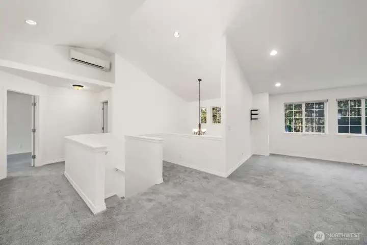 Upstairs landing with large bonus room a vaulted ceilings. Plus mini splits for A/C and heating.