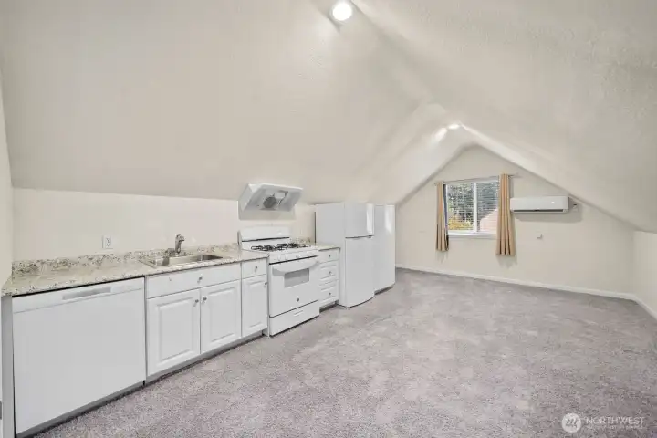 Overview of the upstairs kitchen. Vaulted ceilings and mini split for A/C and heating.