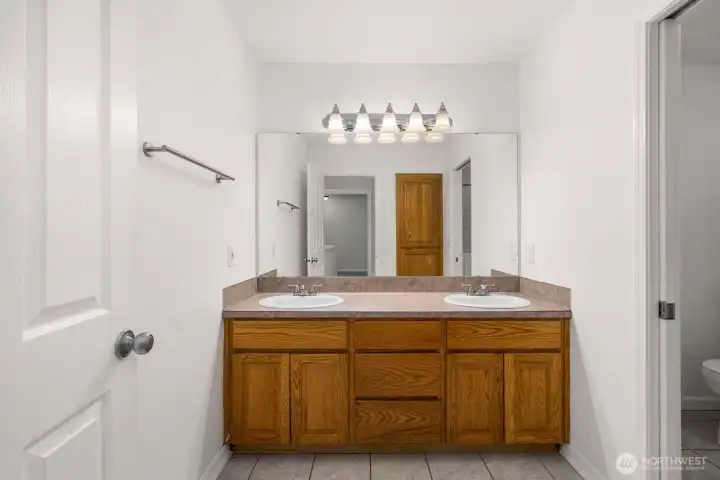 Upstairs full bathroom, one side.