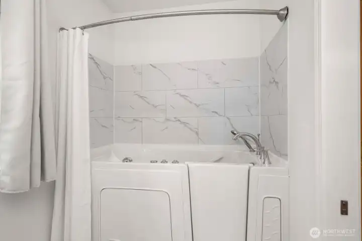 Walk in tub and shower combo.