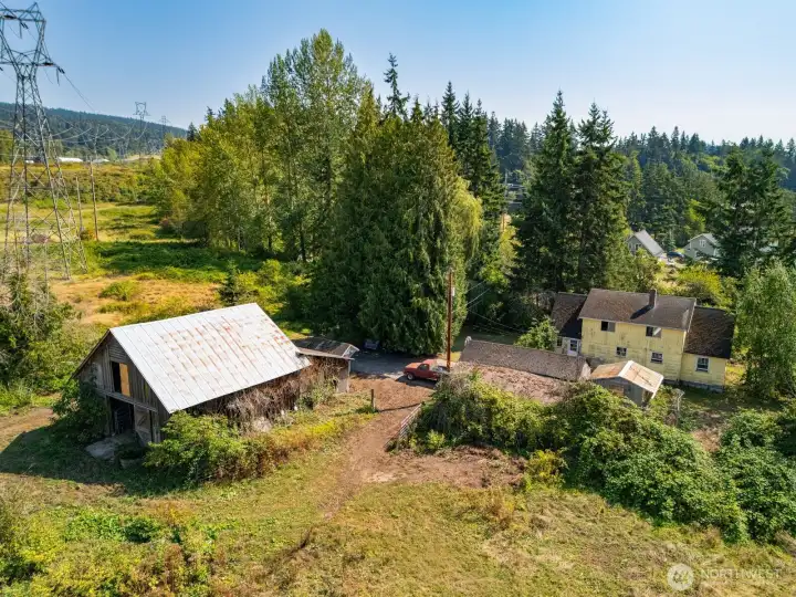 Barn, old outbuildings and house.