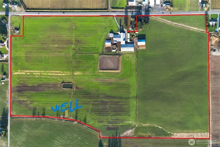 Photo of well location along the Southern border of propety, Their are 2 seperate, 5 inch, Mainlines running North and South across the property