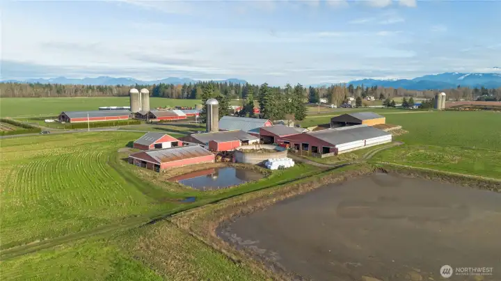 NE views toward the Canadian Mountains. Currently an established dairy farm. 1.6 million gallon lagoon, a 400 gallon water lagoon and a concrete holding tank.
