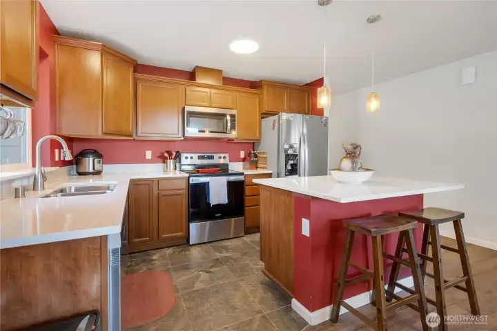 Stainless Steel appliances, Quartz Counters, Tile Floors.  Center island with breakfast bar!