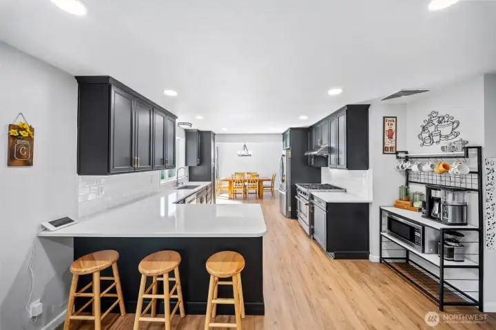 Eating bar so friends and family can join in on the fun. Easy care LVP flooring, loads of storage and counter space