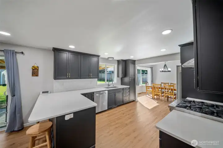 Durable and easy care quartz counters and a full height subway tile backsplash