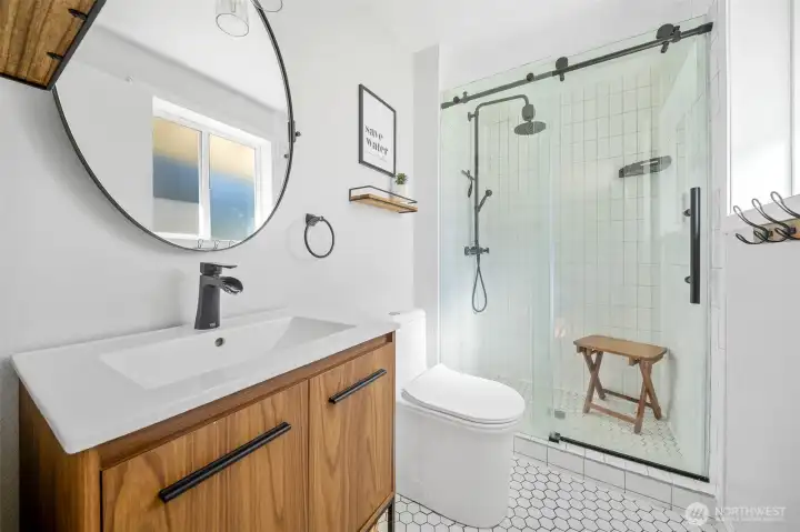 Ensuite primary bath has been completely updated, stem to stern. All new shower with glass door, vanity with solid surface and newer toilet and hardware