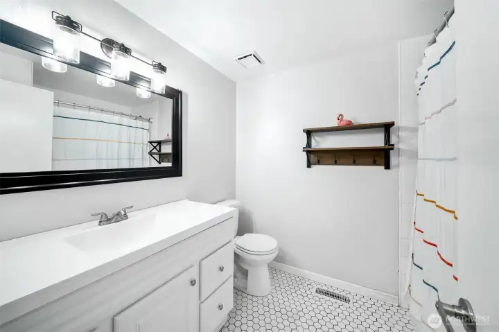 Shared bath is updated with newer vanity, flooring, lighting and more!