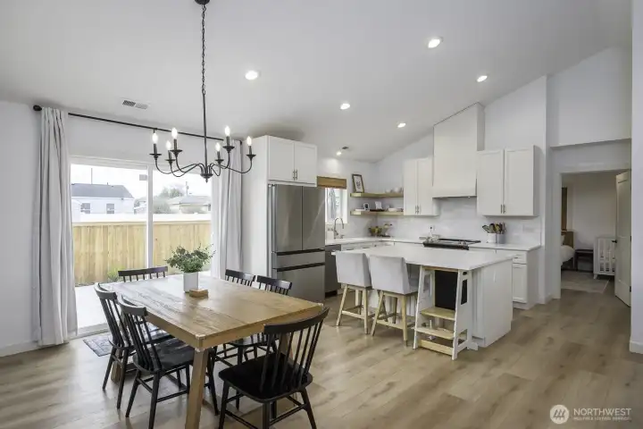 The dining area opens to the back patio for both inside and outside entertaining and dining options