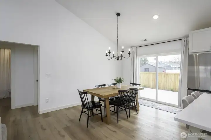 Notice the high ceiling and beautiful flooring throughout the home