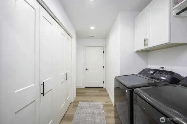 This is the utility room with the pantry on the left