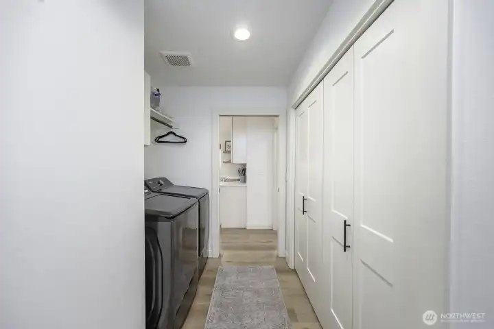The door at the end leads into the two car garage with built-in shelving