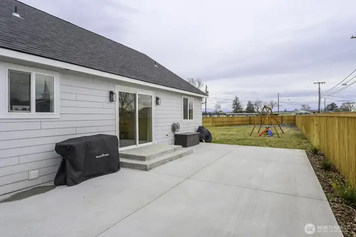 The patio is large and opens to the side yard offering a space for all to enjoy