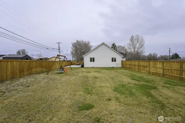 The back yard in completely fenced with lots of room for one's choice from RV or boat parking, sports activities and games; but also a shop or even an ADU perhaps