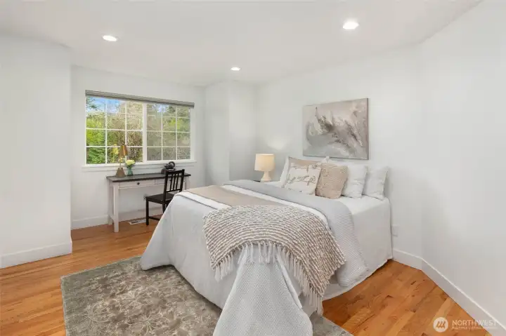 Upper-level bedroom (1) w/walk-in closet.