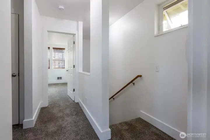 2nd floor hallway with all new carpeting to both bedrooms.