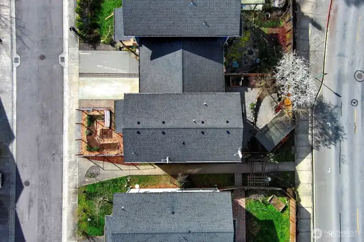 Aerial view of townhouse. A walkway beside property to Guard Street.