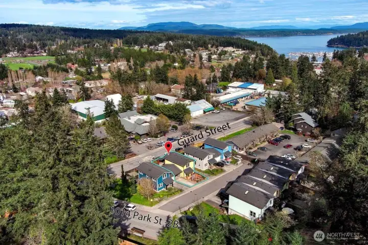 Townhouse backs up to Guard Street to the north. Across from Library. Short walk to town, schools, librar, post office and the 30+ acre John O. Linde Community Park.