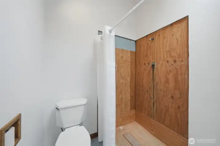 Efficient guest bathroom layout with a walk-in shower.