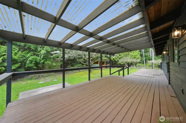 Covered deck section allows for year-round outdoor enjoyment.