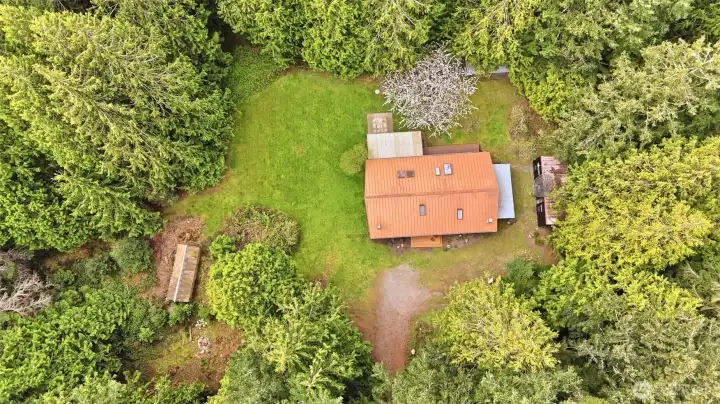 Overhead view of the home site illustrating the balance of sun-drenched lawn and shade trees.