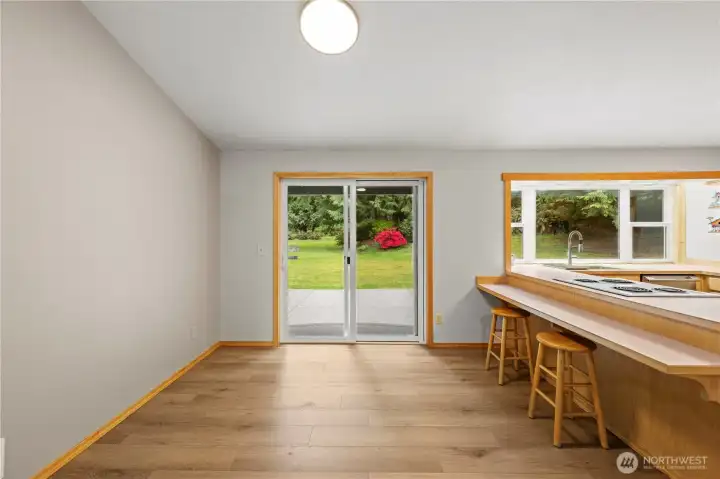 Original eat-in kitchen with slider to back patio.
