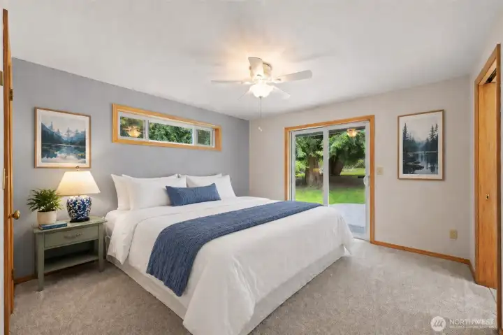 Primary bedroom  with slider to back patio (+3/4 bath &  walk in closet)