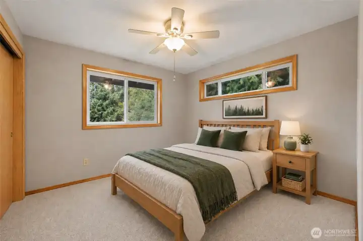 Virtually staged second bedroom is perfect for family or guests.