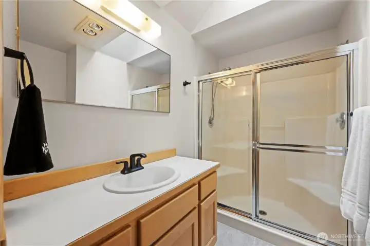 Primary 3/4 bathroom, with walk in shower.