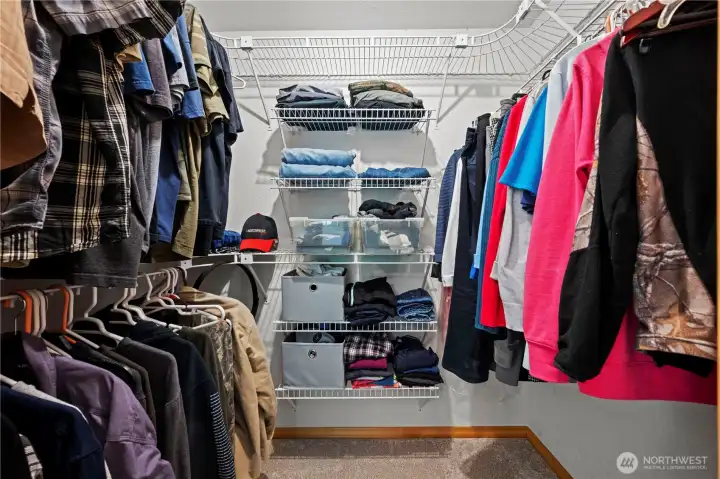 Primary walk in closet with lots of storage!