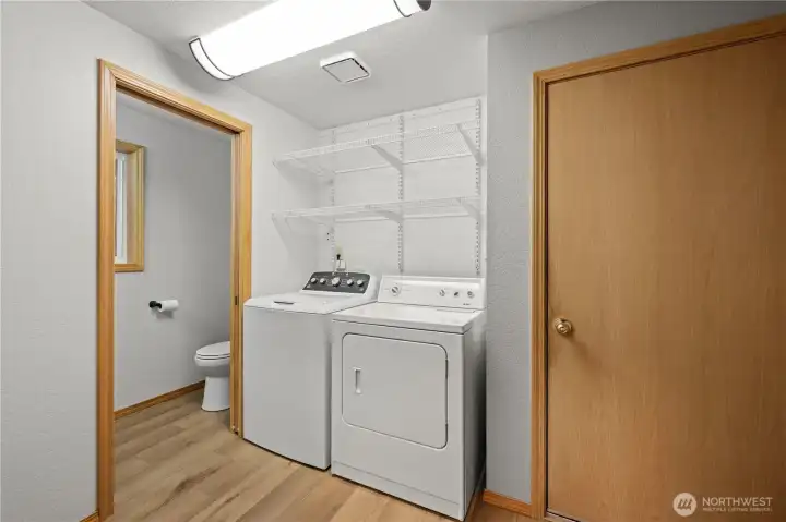 Laundry room off the kitchen, 1/2 bath and entrance to attached 2 car garage.