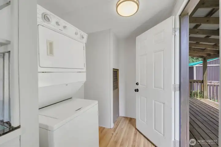 Stack washer & dryer + Extra Storage & door to covered deck and fenced yard.