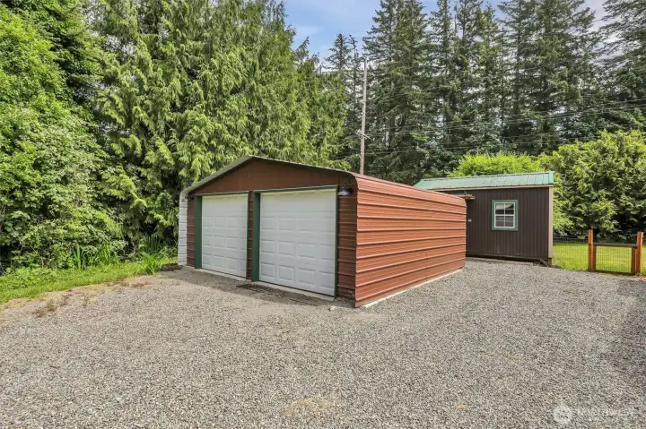 2 car detached garage, with man door on the back.