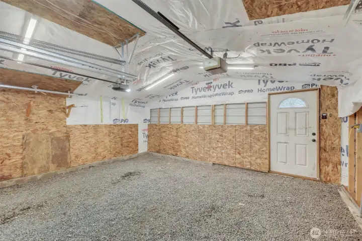 2 car garage looking at the back with the door