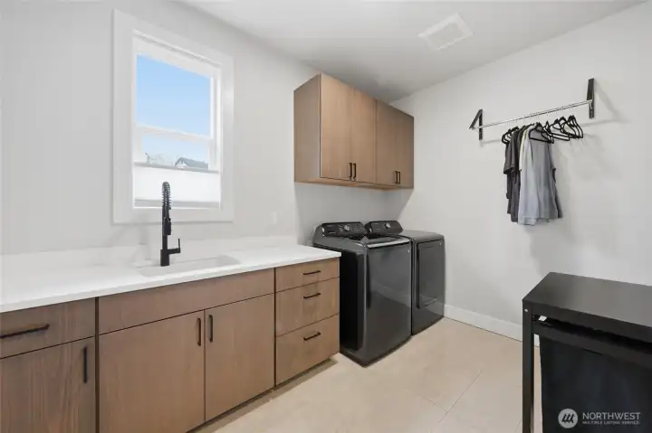 Large Laundry room with Laundry Sink and plenty of Storage