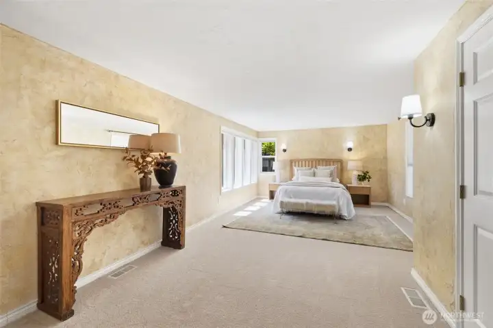 Spacious primary suite provides a comfortable and private space to rest after enjoying the day on the lake.
