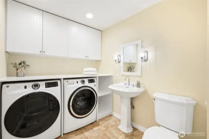 Main level half bath/laundry room off of the kitchen.