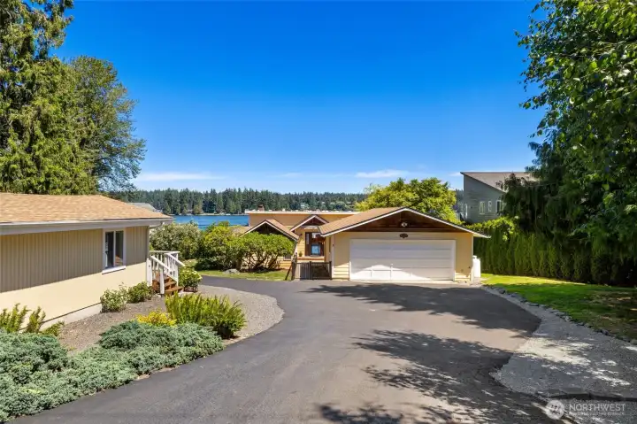 Private driveway with plenty of parking. ADU/guest cottage is the structure to the left.