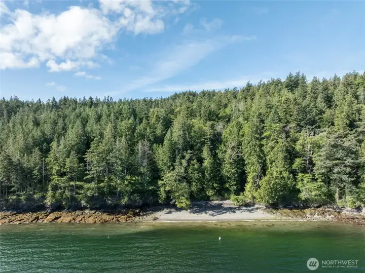 Aerial view of the shoreline and private beach access. Aerial view of the shoreline and private beach access.