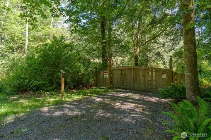 Gated access from Dolphin Bay County Road. Lush green forest all around. Gated access from Dolphin Bay County Road. Lush green forest all around.