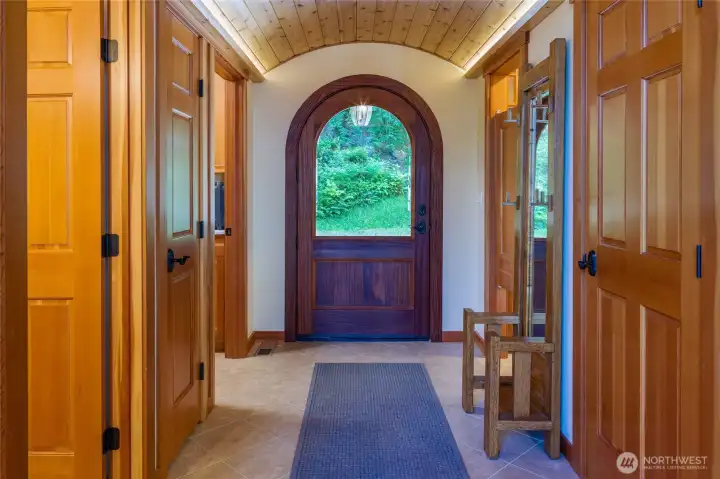 Entry into the home. Mudroom/laundry and guest bath on left side of photo. Butler's pantry and hall closet on right. Entry into the home. Mudroom/laundry and guest bath on left side of photo. Butler's pantry and hall closet on right.