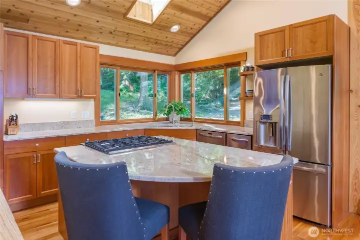 Plenty of counter space and natural light. Kitchen windows look out to the forrest. Plenty of counter space and natural light. Kitchen windows look out to the forrest.