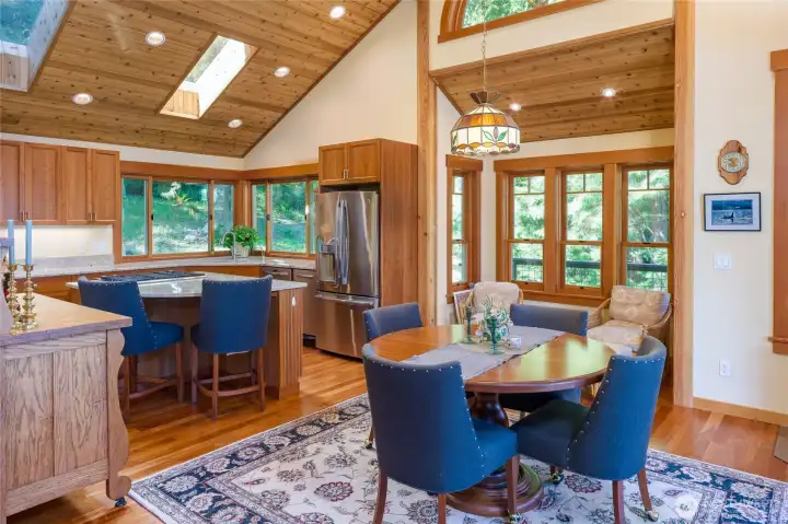 Open floor plan is inviting with vaulted ceiling, large windows, skylights and wood flooring and trim. A craftsman that showcases island style beauty. Open floor plan is inviting with vaulted ceiling, large windows, skylights and wood flooring and trim. A craftsman that showcases island style beauty.