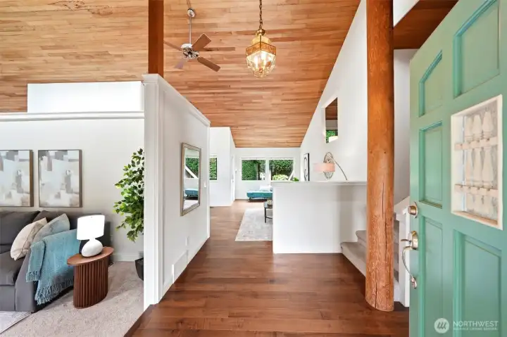 Bright, open entry with custom wood accents.