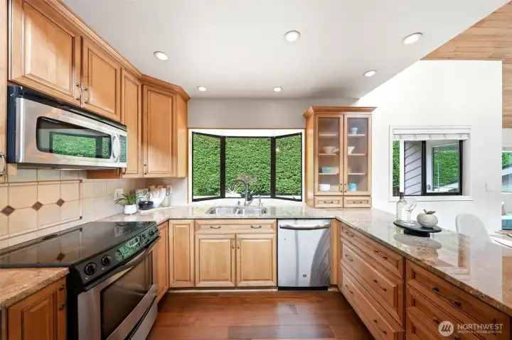 Light-filled kitchen with lush views