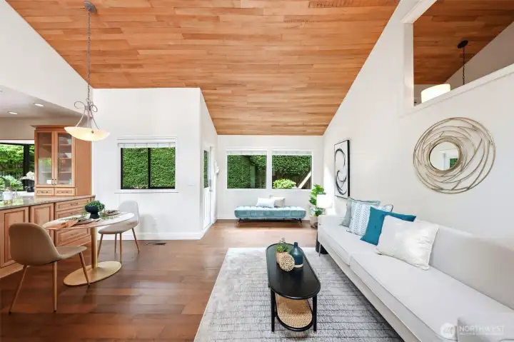 Second living space off kitchen with vaulted ceilings & deck access