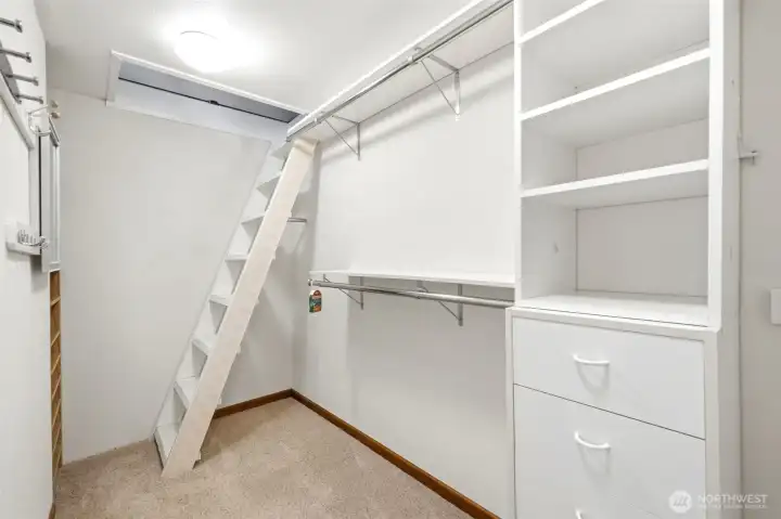 Primary closet with access to finished loft